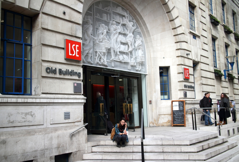 An old building of london school of economics where students are talking