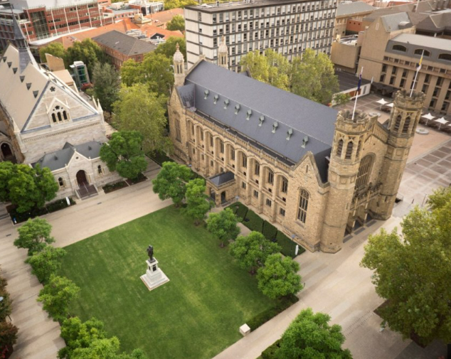 Aerial view of University of Adelaide with a statue in front.